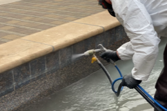 Pool Master cleaning pool tile